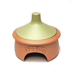 an orange and green ceramic object on a white surface with the word friglio printed on it