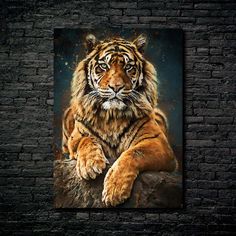 a large tiger sitting on top of a brick wall next to a black brick wall