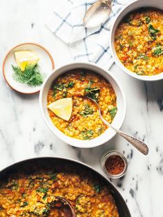 two bowls of soup on a marble table