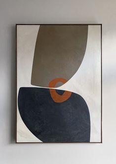 an abstract painting hangs on the wall