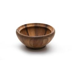 a wooden bowl sitting on top of a white surface