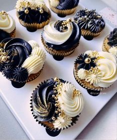 there are many cupcakes with black and white frosting