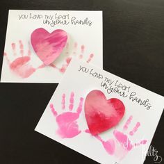 two handprinted cards with hearts on them and the words you love my heart in your hands