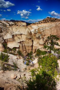 people are standing in the middle of a canyon