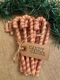 candy canes wrapped in twine and tied with string