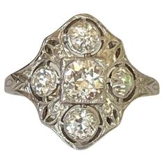 an antique diamond ring with three stones in the center