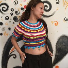 This gorgeous striped cropped top is the perfect addition to your spring wardrobe! Its multi-colored  is a cheerful nod to hippie, retro style. Handmade with precision and care, it is crafted with soft and cozy eco-friendly materials and vibrant colors, ensuring you stand out in any crowd. Whether you're lounging with friends or out on an evening stroll, this handmade open front top will keep you cozy in style. The top adds cheerfulness to any outfit and is sure to bring a bright spot to your spring wardrobe. It will be your go-to short crochet top. 34 ( xs ) & 36 ( s ) size  chest circumference: 80 cm (31.4 inches) length : 36 cm (14.1 inches) Yarn : 55% Organic Cotton - 45 % Premium Acrylic CARE Wash at hand or in the machine at 30C / 86F. Do not wring out. Lay flat to dry to maintain th Crochet Cropped Sweater, Open Front Top, Knit Clothing, Fall Stripes, Hand Knit Sweater, Sweater Crochet, Crochet Crop, Hand Knitted Sweaters, Cropped Tube Top