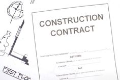 the construction contract is laying out on top of some paper with drawings and pencils