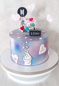 a cake decorated with cartoon characters and balloons