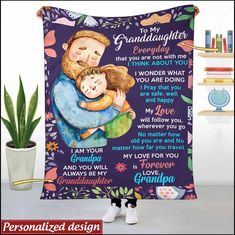 a purple blanket with an image of a man holding a child and the words granddaughter on it