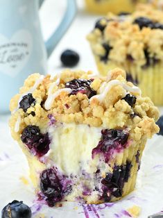 blueberry muffins with crumbled topping on top