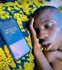 a man laying on top of a blue pillow next to a cell phone with the message i will always be able to use it