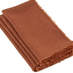 four brown towels folded on top of each other