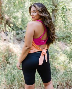 The Peach Tie Back Halter Top has an open back to show off your favorite sports bra! AND, it's so breathable and lightweight, it just might be your new workout top! Sporty T-back Halter Top For Sports, Stretch T-back Halter Top For Gym, Athleisure Stretch Halter Top With Built-in Bra, Sporty Sleeveless Halter Top With Built-in Bra, Sporty Stretch T-back Halter Top, Sleeveless Halter Top With Built-in Bra For Workout, Athleisure Top With Built-in Bra And Halter Neck, Moisture-wicking Cross Back Summer Activewear, Summer Moisture-wicking Cross Back Activewear