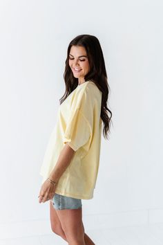 Features Round Neck Short Sleeves Pastel Yellow Color 100% Cotton Size + Fit Small 0-4, Medium 4-8, Large 8-12 Kristin is 5'4", a size 1 and is wearing a Small Oversized fit, size down if you want less oversized. Above recommendation is for an oversized fit. Click here for shorts in photos Click here for shorts in Aimee's try on video British Indian