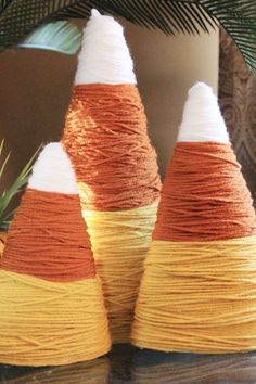 three orange, white and yellow cones sitting on top of each other