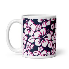 a coffee mug with pink and white flowers on it