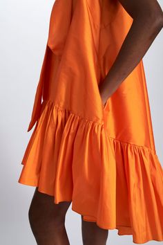 Taffeta trapeze dress with self scarf-tie and gathered hem detail. Shown in Tangerine. Silk A-line Dress With Bow, Silk A-line Dress With Voluminous Skirt, Spring A-line Taffeta Mini Dress, Spring Taffeta A-line Mini Dress, Silk Dress With Voluminous Gathered Skirt, Silk Summer Dress With Voluminous Skirt, Summer Silk Dress With Voluminous Skirt, A-line Taffeta Dress With Ruffles, Chic Summer Taffeta Dress