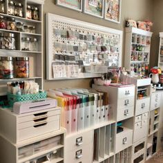 an organized craft room with lots of drawers