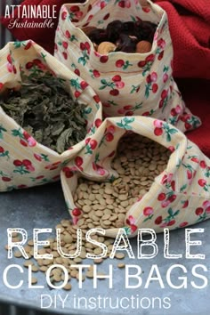 three reusable cloth bags are sitting on a table with beans and other items