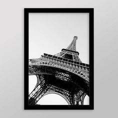 black and white photograph of the eiffel tower in paris, france on a wall