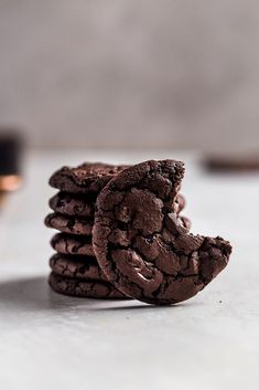 chocolate cookies stacked on top of each other with the words super chewy and chocolate brownie cookies