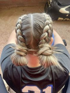 Gameday hair dutch braids with buns sporty hairstyles Dragon French Braid, Cute Hairstyles For Running, Dutch Braid Hairstyles For Softball, Sport Updos, Sport Hairstyles With Ribbon, French Vs Dutch Braid, Dutch Braid Into Bun, Cute Game Day Hairstyles Volleyball, Braids With Buns