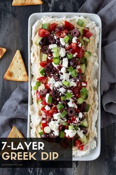 an appetizer with pita bread, olives, tomatoes and feta cheese