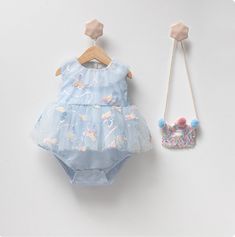 Introducing our enchanting 100% Cotton Butterfly Blue Baby Romper! Wrap your little one in the beauty of fluttering butterflies and the pure comfort of 100% cotton with our Butterfly Blue Baby Romper. Meticulously crafted with love and attention to detail, this romper is designed to cradle your precious bundle in softness while adding a touch of whimsy to their wardrobe. 🦋 Features: Adorable Butterfly Pattern: Delicate and charming butterflies dance across the fabric, creating a sweet and playful look that's perfect for your baby. 100% Cotton Fabric: Crafted from the finest quality pure cotton, this romper ensures unmatched comfort and breathability for your baby's delicate skin. Effortless Diaper Changes: Thoughtful snap closures along the bottom ensure quick and easy diaper changes, whi Playful Tulle Tutu Dress For Summer, Floral Applique Dress For Summer Birthday, Summer Baptism Tutu Dress With Floral Applique, Cute Tutu Dress For Baptism In Summer, Blue Spring Tutu Dress For Birthday, Blue Spring Birthday Tutu Dress, Blue Tutu Dress For Birthday In Spring, Playful Blue Tutu Dress For Spring, Light Blue Tutu Dress For Spring Baptism