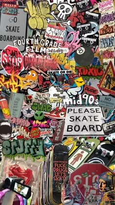 a pile of assorted skateboard stickers and decals