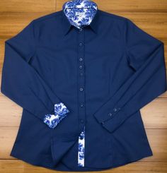 Chic and smart too! This stunning navy-blue cotton twill shirt is contrasted with a tremendous delft blue floral design to make this a great everyday wardrobe staple. Darted front and back provide a more tailored and figure-hugging look. DETAILS Material (100% micro twill cotton) Turn back Cuffs Contrasting color and cuffs Anti-gape Button placket Care (Machine wash at 30°) Country of Origin (Thailand) Blue Floral Design, Delft Blue, Twill Shirt, Everyday Wardrobe, Delft, Button Placket, Blue Floral, Cotton Twill, Wardrobe Staples