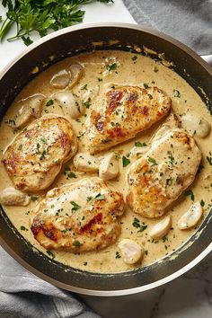 chicken with mushroom sauce in a skillet