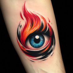 an eye tattoo on the arm with red and blue flames coming out of its iris