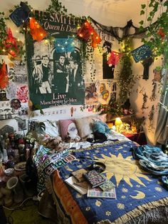 a bedroom decorated for christmas with lights and decorations on the wall above the bed, surrounded by plants