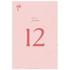 a pink calendar with the number twelve and palm trees in red ink on a white background