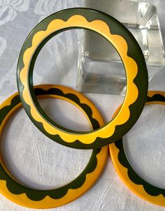 Super hard to find Daisy spacers. Set of 3. Dark green and butterscotch. Patterned both sides, matte, warm patina. Skinny, 1/8" wide. Second to last photo shows them doing their spacer job, last photo is Simichrome test positive. *Several estate Bakelite listings up, more to come. Green Patina Bangle Bracelet, Green Bangle Bracelets With Patina, Unique Green Round Bangle, Vintage Green Bracelet With Patina, Bangles Set, Vintage Bakelite, More To Come, Bangle Set, Dark Green