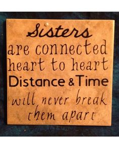 a sign that says sisters are connected heart to heart distance and time will never break them apart