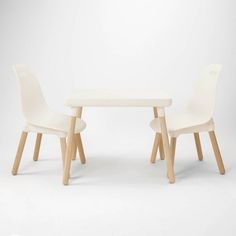 two white chairs and a table against a white background with the word love written on it