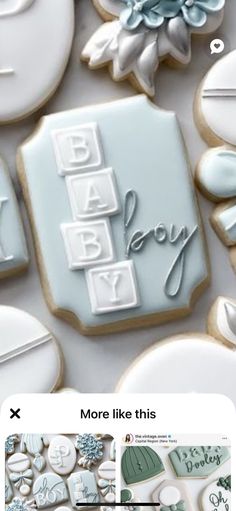 the cookies are decorated with blue and white icing