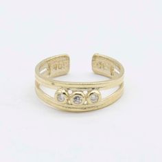 "Adjustable CZ Three-Stone Bezel Set Toe Ring Solid Real 10K Yellow Gold * Metal : Real 10K Yellow Gold (Properly Stamped, 10K)  * Condition : Brand New  * Finish : Polished  * Average Weight : 1.10 grams  * Length : 5mm = 3/16\"  * Width : 8mm = Just over 1/4\"  * Clasp/Bail : Adjustable All of our items are brand new and are shipped with a gift box." Toe Ring, Body Jewellery, Jewelry Business, Toe Rings, Buying Jewelry, Three Stone, Bezel Setting, Ring Bracelet, Earring Necklace