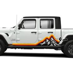 a white jeep with an orange and black mountain decal on it's side