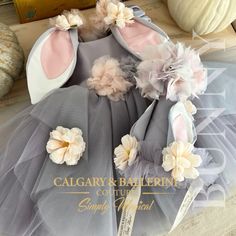 a dress made out of tulle with flowers on it