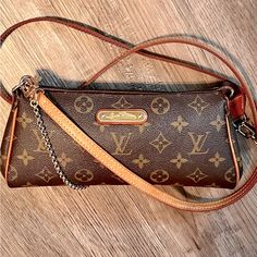 -Previously Owned And In Pristine Condition! -Wear 2 Ways, Long Vachetta Shoulder Strap And Untarnished, Gold Wristlet Chain -Fully Working Zipper -Gently Used -If You Have Any Questions, Please Feel Welcome To Ask! Louis Vuitton Bags, Authentic Louis Vuitton, Brown Gold, Louis Vuitton Monogram, Louis Vuitton Bag, Shoulder Strap, Bag Lady, Louis Vuitton, Monogram