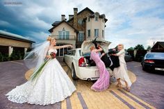 the bride and groom are getting into their car