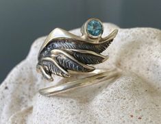 silver angel wing with a blue topaz Wing Ring, Angel Wing Ring, Wide Silver Ring, November Birthstone Ring, Snake Ring Silver, Blue Topaz Gemstone, Blue Stone Ring, Contemporary Ring, Gem Ring