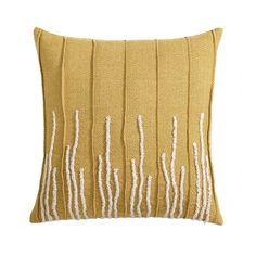 a yellow pillow with white lines on it