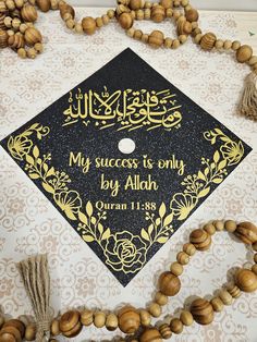 a black and gold graduation cap with the words my success is only by aloh written on it