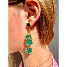 Upgrade your luck with our Luck Galore dangle earrings! These stunning emerald green and gold earrings will add a touch of sparkle to any outfit. Inspired by the iconic Van Cleef & Arpels lucky charm, these earrings are a must-have for any jewelry collection. Boost your luck and style with these elegant earrings. Green Pierced Jewelry For Party, Trendy Green Dangle Jewelry, Trendy Green Metal Jewelry, Green Metal Dangle Earrings, Green Jewelry With Dangling Charms As Gift, Green Jewelry With Dangling Charms For Gift, Green Dangle Jewelry For Party, Dangle Earrings With May Birthstone In Metal, Pierced Green Gold-plated Earrings