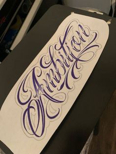 a piece of paper that has some type of writing on it with the word hello written in purple ink