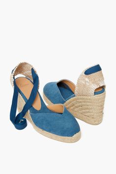 Founded in Spain in 1927, Castaner designs beautiful espadrilles fit for any outfit, day or night. We reach for these shoes all spring, summer, and resort season long.Trendy yet wearable, and oh-so-practical for any event, the Claro Wedges are a Tuckernuck favorite. Featuring a jute espadrille sole, canvas upper, and chic ankle ties, these are a fun boho addition to any outfit. Perfect for getaways to tropical locations, seaside weddings, and al fresco dinner parties, we are wearing these with w Summer Slip-on Heels With Rubber Sole, Chic Open Heel Espadrilles For Vacation, Spring Closed Toe Heels With Rubber Sole, Spring Heels With Rubber Sole And Closed Toe, Chic Summer Espadrilles With Textured Sole, Espadrilles With Leather Sole For Vacation, Spring Espadrille Wedge Sandals With Textured Sole, Vacation Espadrilles With Removable Insole And Open Heel, Spring Closed Toe Wedge Sandals With Textured Sole